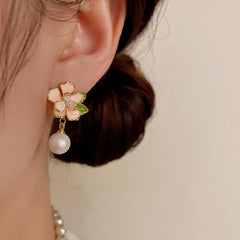 Close-up detail of the sparkling zircons and plating on the Camellia Pearl Earrings