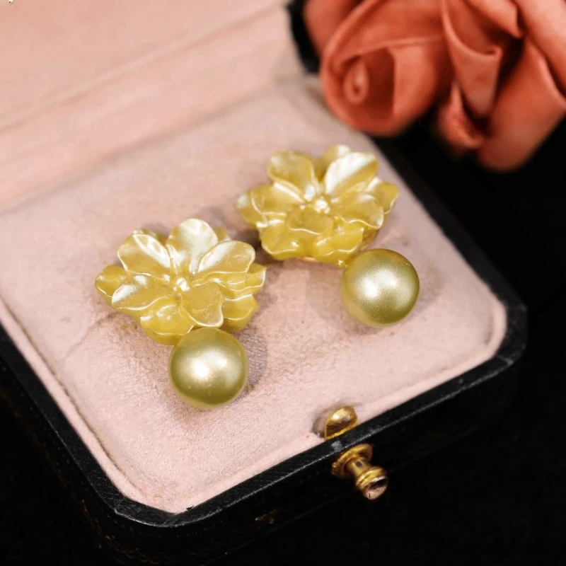 Angled view of the 14K Gold-Plated Elegant Camellia Pearl Earrings