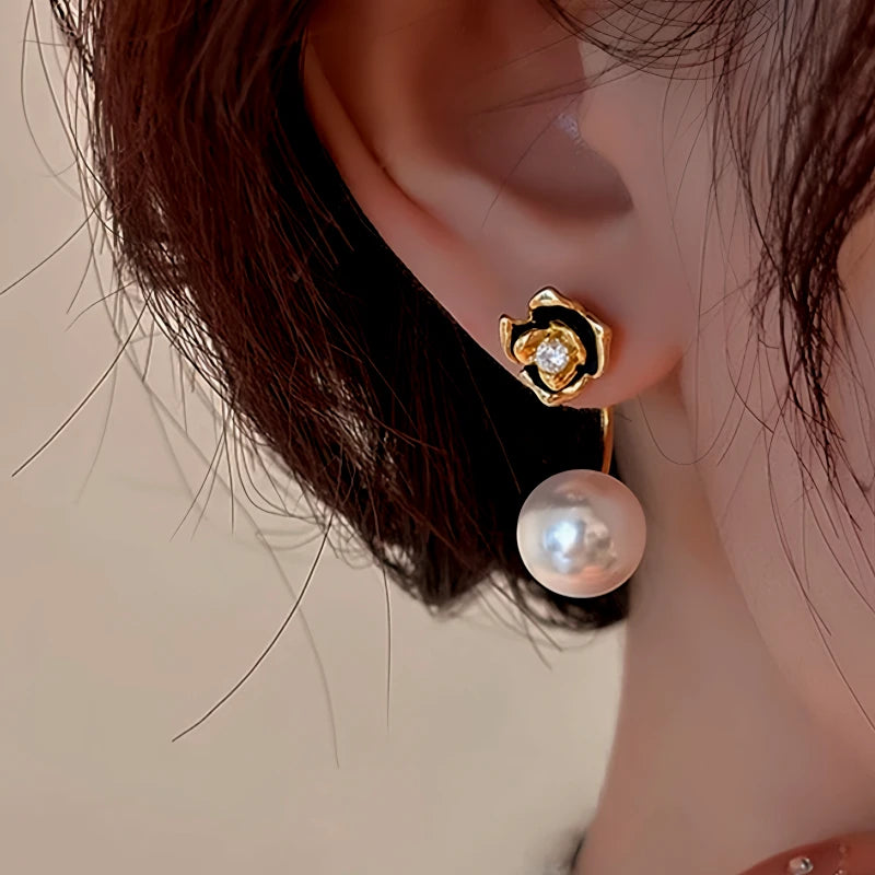 Angled view of the 14K Gold-Plated Elegant Camellia Pearl Earrings