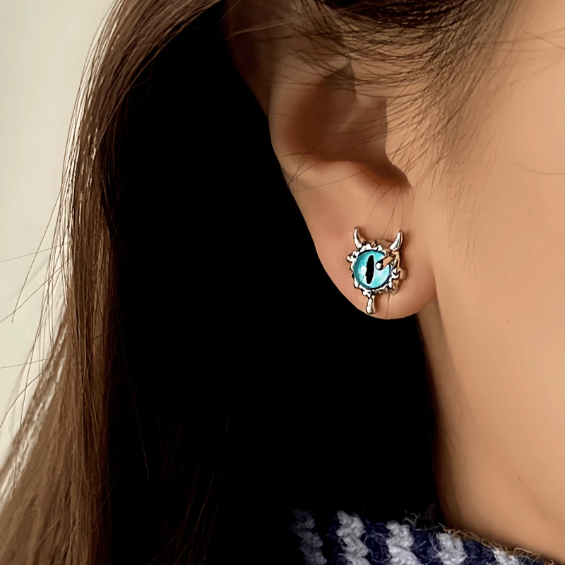 Close-up detail of the sparkling zircons and plating on the Devil Stud Earrings