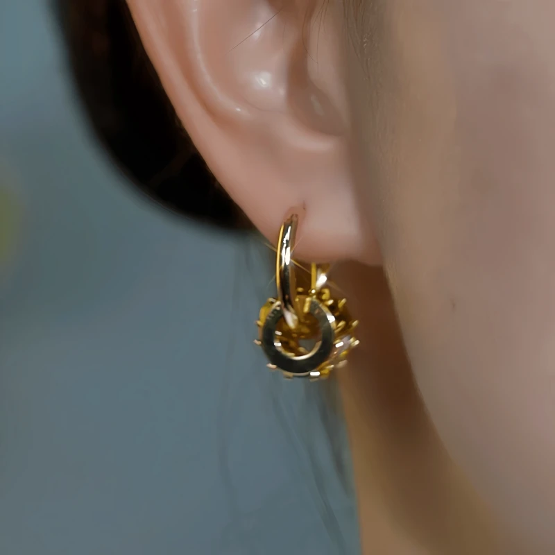 Model showcasing the dangle and style of the 14K Gold-Plated Elegant Cat's Eye Stone Ring Earrings