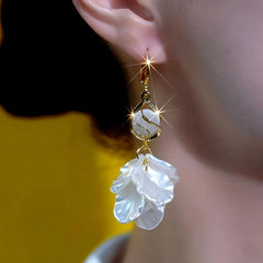 Close-up detail of the sparkling zircons and plating on the Shell Tassel Earrings