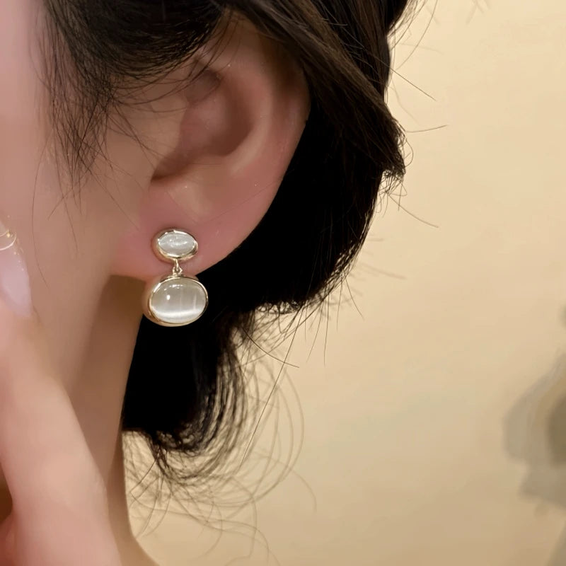 Angled view of the 14K Gold-Plated Elegant Cat's Eye Stone Water Drop Earrings