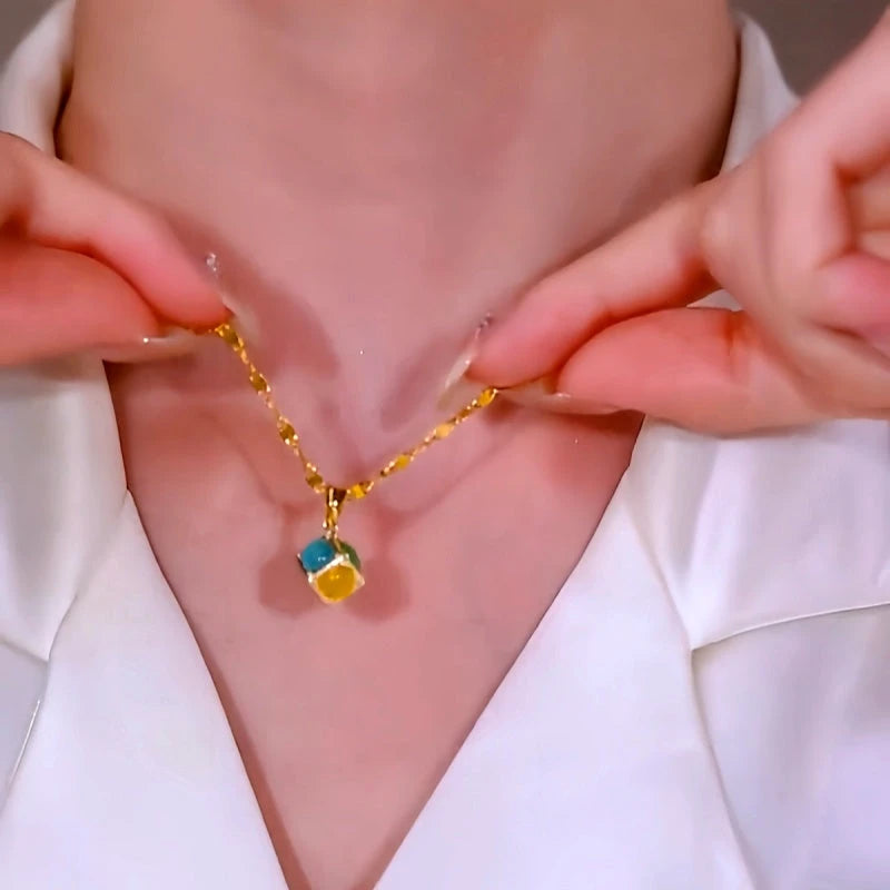 Close-up of the pendant and clasp on the Colorful Ball Necklace