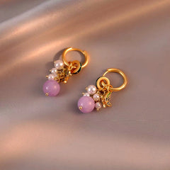 Model showcasing the dangle and style of the 14K Gold-Plated Elegant Colorful Butterfly Bead Tassel Earrings