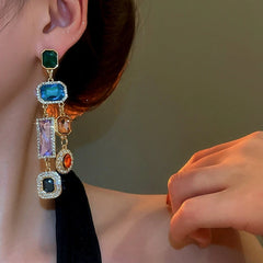 Angled view of the 14K Gold-Plated Elegant Colorful Diamond Tassel Earrings