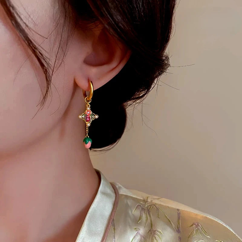 Model showcasing the dangle and style of the 14K Gold-Plated Elegant Colorful Oil Drop Tulip Flower Tassel Earrings