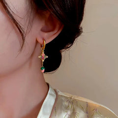 Model showcasing the dangle and style of the 14K Gold-Plated Elegant Colorful Oil Drop Tulip Flower Tassel Earrings