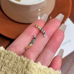 Angled view of the 14K Gold-Plated Elegant Colorful Zircon Smile Face Stud Earrings