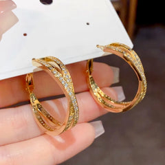 Angled view of the 14K Gold-Plated Elegant Cross Daimond Hoop Earrings