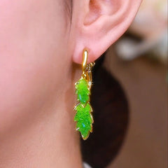 Close-up detail of the sparkling zircons and plating on the Leaf Cross Earrings