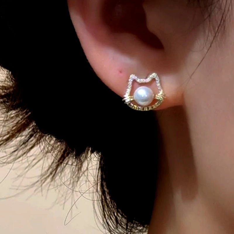 Close-up detail of the sparkling zircons and plating on the Cat Pearl Studs