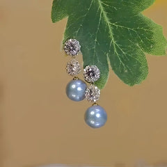 Close-up detail of the sparkling zircons and plating on the Blue Pearl Earrings