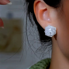 Model showcasing the dangle and style of the 14K Gold-Plated Elegant Diamond Rose Earrings