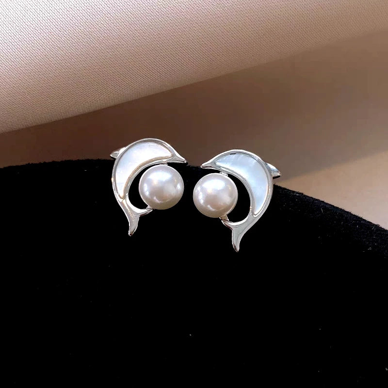 Angled view of the 14K Gold-Plated Elegant Dolphin Pearl Stud Earrings