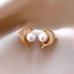 Close-up detail of the sparkling zircons and plating on the Dolphin Pearl Studs