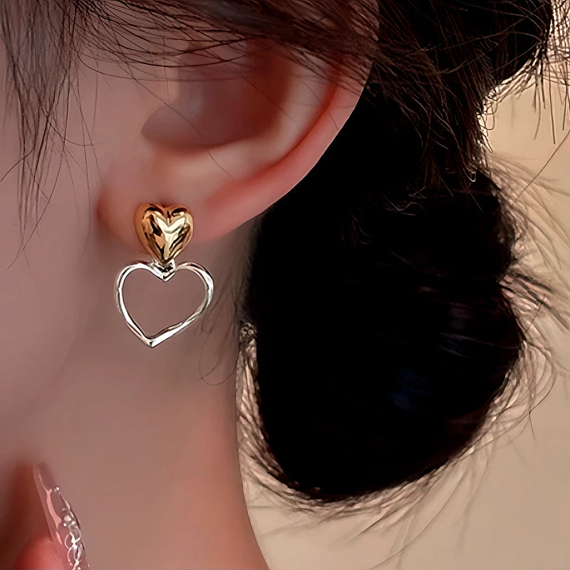 Close-up detail of the sparkling zircons and plating on the Double Heart Earrings