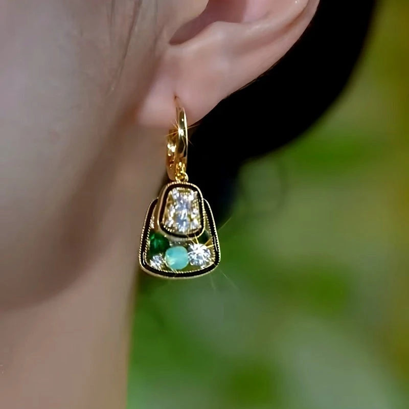 Model showcasing the dangle and style of the 14K Gold-Plated Elegant Double-Layer Zircon Diamond Earrings