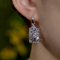 Close-up detail of the sparkling zircons and plating on the Tassel Earrings