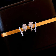 Close-up detail of the sparkling zircons and plating on the Tulip Pearl Studs