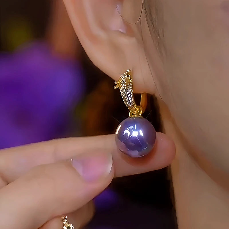 Close-up detail of the sparkling zircons and plating on the Dragon Pearl Earrings