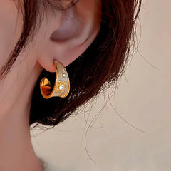 Model showcasing the dangle and style of the 14K Gold-Plated Elegant Enamel Flower Earrings