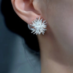 Model showcasing the dangle and style of the 14K Gold-Plated Elegant Fireworks Pearl Jacket Earrings