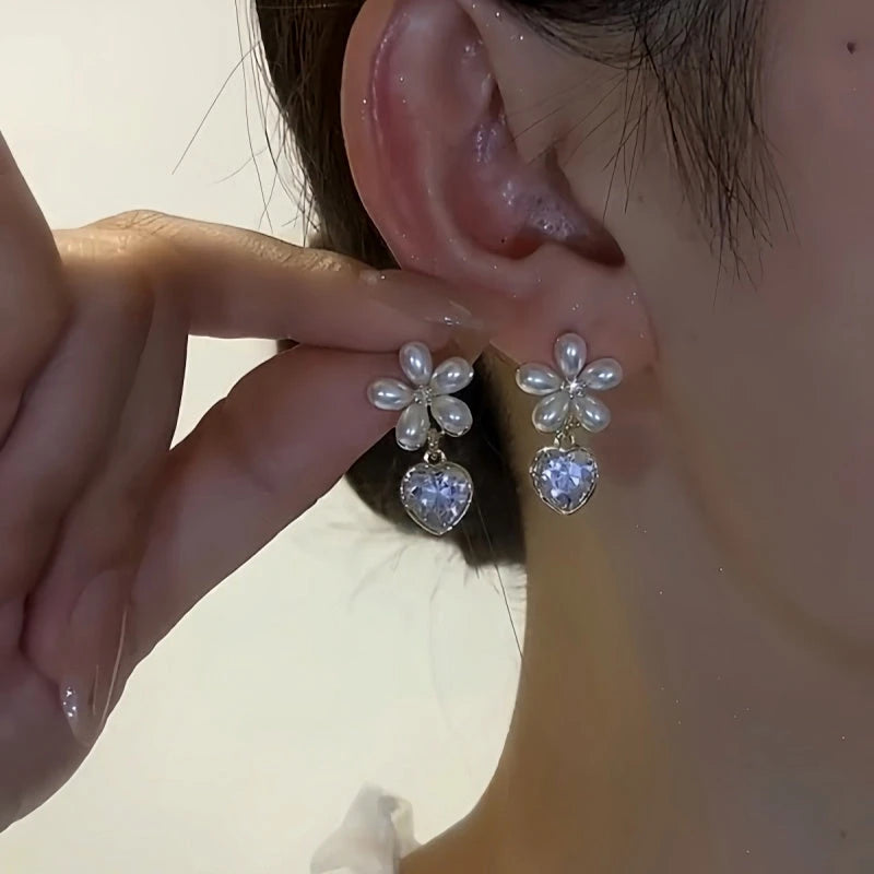 Close-up detail of the sparkling zircons and plating on the Crystal Heart Earrings