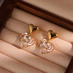 Model showcasing the dangle and style of the 14K Gold-Plated Elegant Flower Heart-Design Earrings