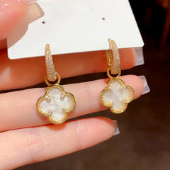 Angled view of the 14K Gold-Plated Elegant Four-Leaf Flower Earrings