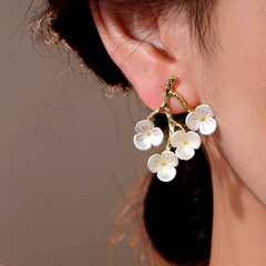 Model showcasing the dangle and style of the 14K Gold-Plated Elegant Fresh Sweet Flower Earrings