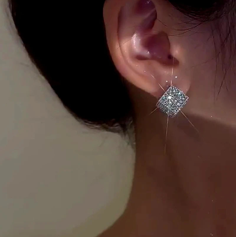 Close-up detail of the sparkling zircons and plating on the Diamond Square Studs