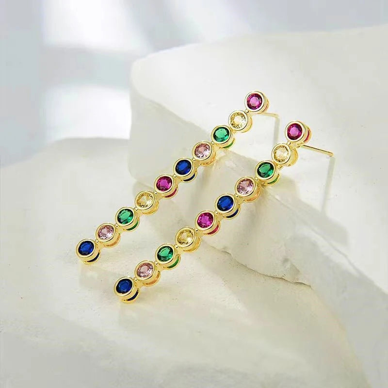 Close-up detail of the sparkling zircons and plating on the Gemstone Tassel Earrings