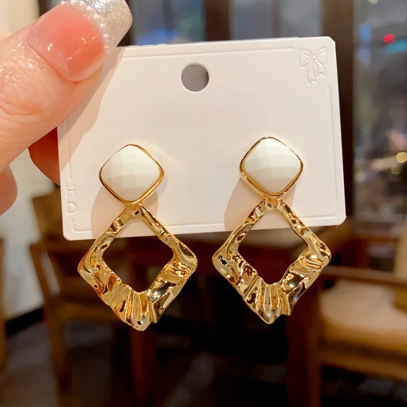 Angled view of the 14K Gold-Plated Elegant Geometric Diamond Earrings