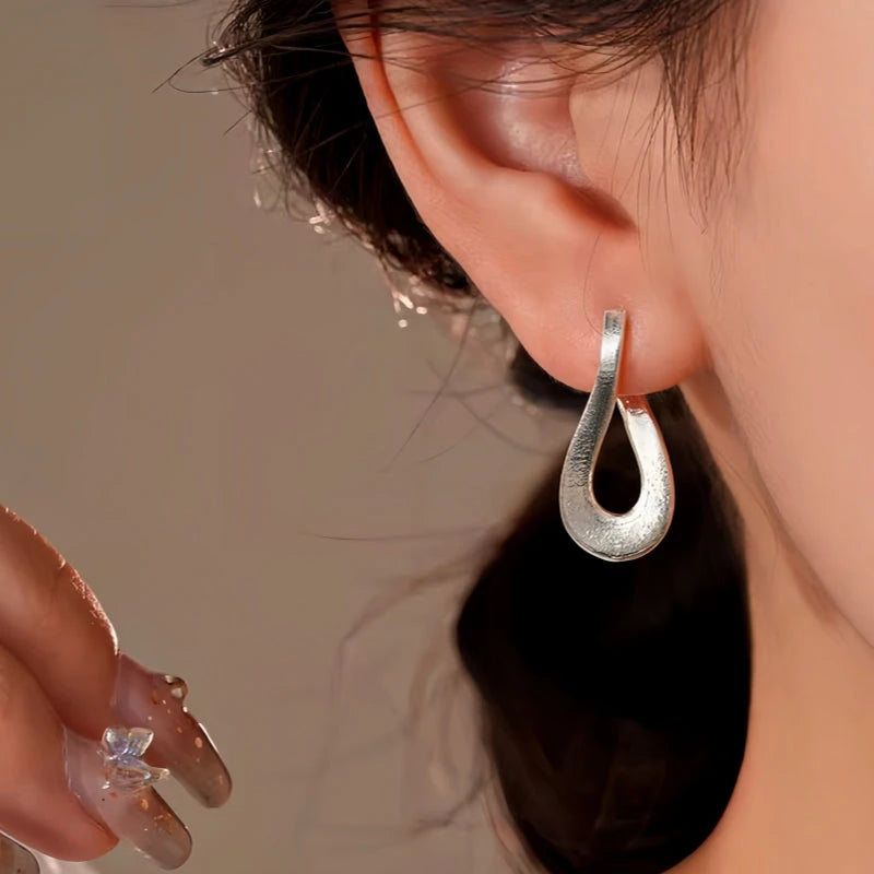 Close-up detail of the sparkling zircons and plating on the Geometric Earrings