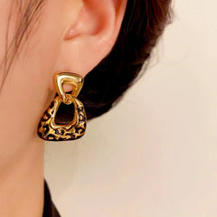 Close-up detail of the sparkling zircons and plating on the Leopard Print Earrings