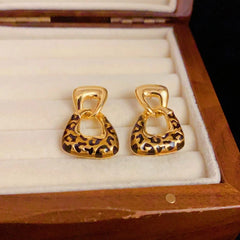 Angled view of the 14K Gold-Plated Elegant Geometric Leopard Print Earrings