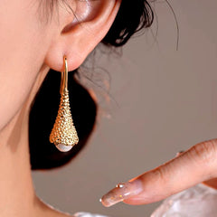 Close-up detail of the sparkling zircons and plating on the Pearl Ear Hooks