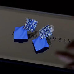 Close-up detail of the sparkling zircons and plating on the Geometric Vintage Earrings