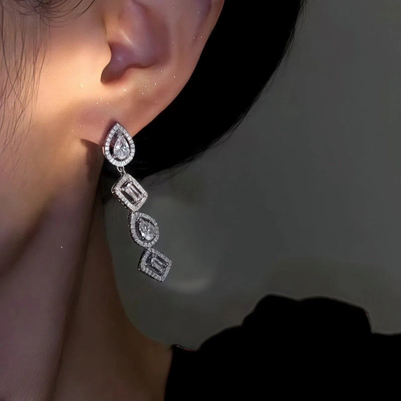 Model showcasing the dangle and style of the 14K Gold-Plated Elegant Geometric Zircon Diamond Earrings