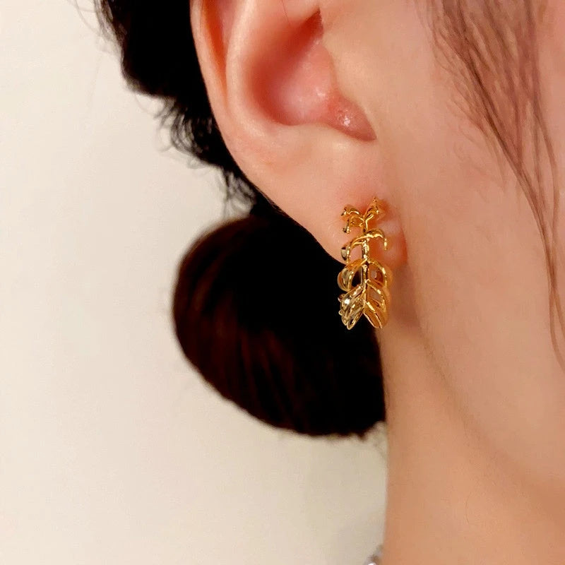 Close-up detail of the sparkling zircons and plating on the Leaf C-Shaped Earrings