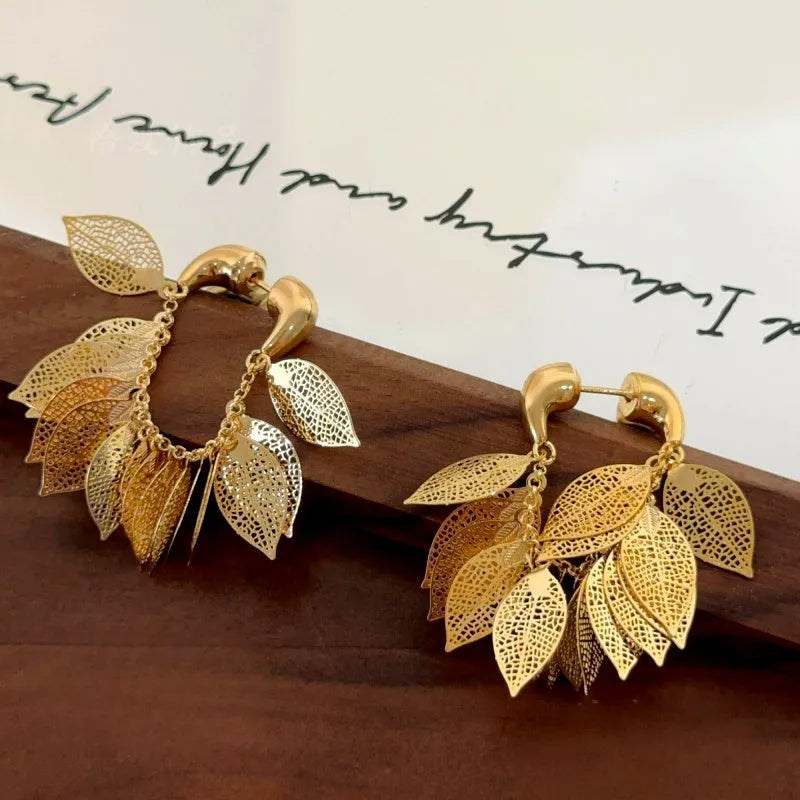 Close-up detail of the sparkling zircons and plating on the Leaf Tassel Earrings