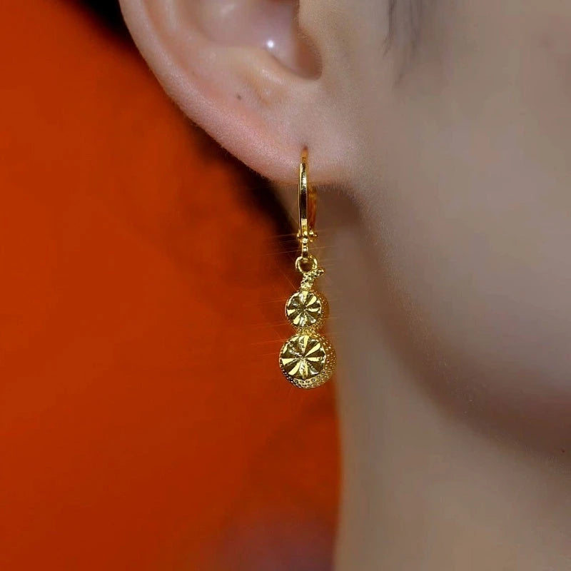 Close-up detail of the sparkling zircons and plating on the Gourd Earrings