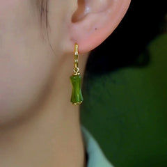 Close-up detail of the sparkling zircons and plating on the Tassel Earrings