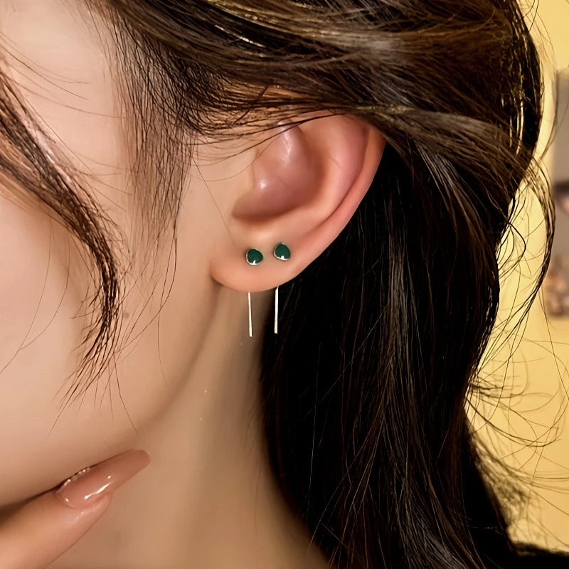 Close-up detail of the sparkling zircons and plating on the Green Threader Earrings