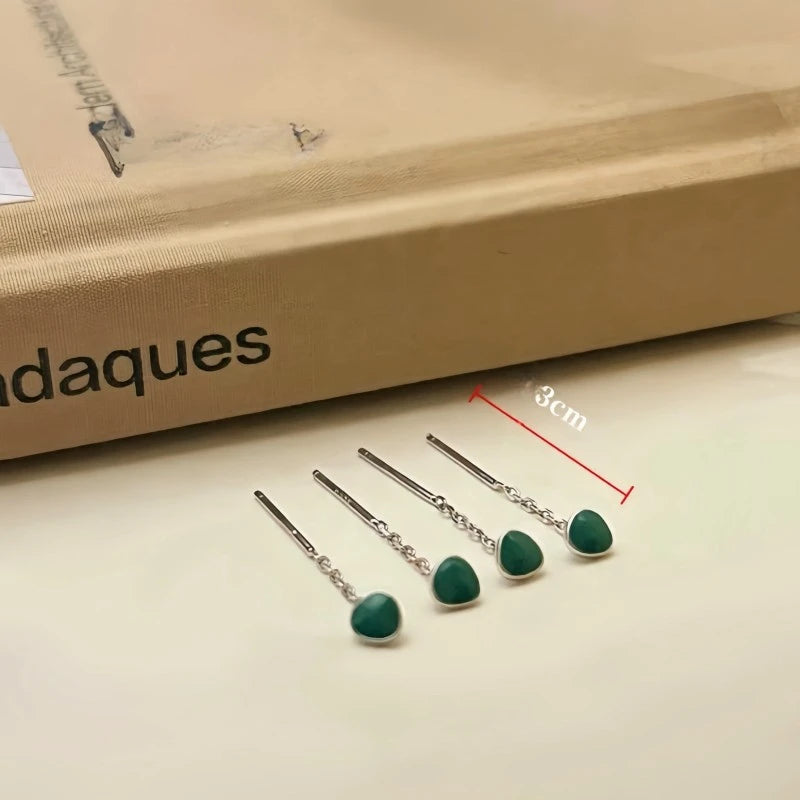 Angled view of the 14K Gold-Plated Elegant Green Bean Threader Earrings