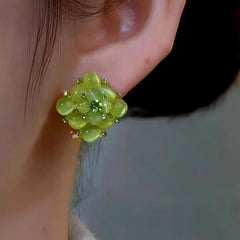 Close-up detail of the sparkling zircons and plating on the Green Stone Studs