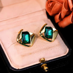 Angled view of the 14K Gold-Plated Elegant Green Crystal Earrings