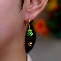 Close-up detail of the sparkling zircons and plating on the Green Gourd Earrings