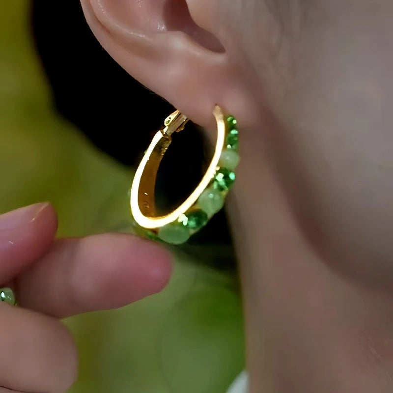 Close-up detail of the sparkling zircons and plating on the Cat's Eye Hoop Earrings